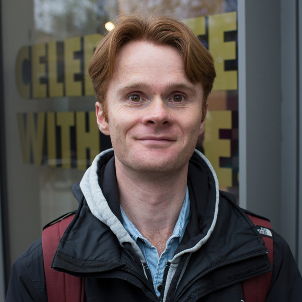 Head and shoulders of Chris Ryan wearing a jacket stood outside looking towards the camera.